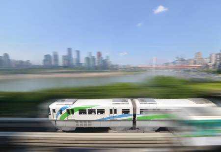 light rail moving on railway in chongqingの写真素材