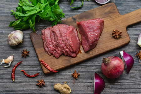 Raw beef meat on a cutting boardの写真素材
