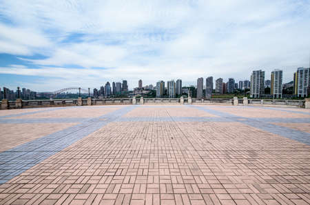 Empty floor with modern skyline and buildingsの写真素材