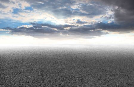 Cloudy sky and asphalt roadの写真素材