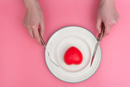 Valentines day table setting with plate On pink backgroundの写真素材