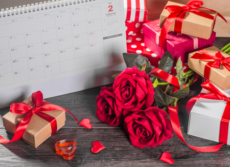 Valentines day background, Valentines day card with roses and gifts on wooden boardの写真素材