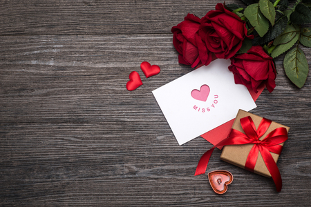 Valentines day background, Valentines day card with roses and gifts on wooden boardの写真素材