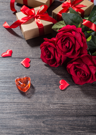 Valentines day background, Valentines day card with roses and gifts on wooden boardの写真素材