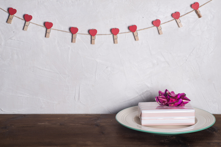 Festive table setting for Valentine's Day with fork, knife and heartsの写真素材