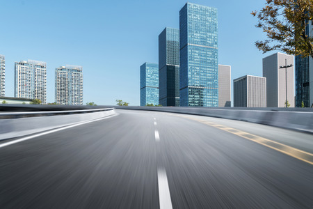 Empty road floor surface with modern city landmark buildings of hangzhou bund Skyline,zhejiang,chinaの写真素材