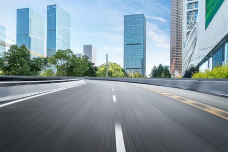 Empty road floor surface with modern city landmark buildings of hangzhou bund Skyline,zhejiang,chinaの写真素材