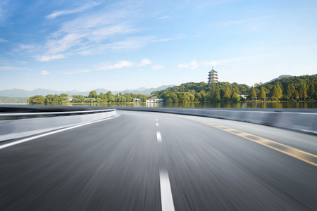Empty road floor surface with modern city landmark buildings of hangzhou bund Skyline,zhejiang,chinaの写真素材