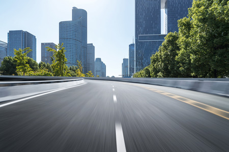 Empty road floor surface with modern city landmark buildings of hangzhou bund Skyline,zhejiang,chinaの写真素材