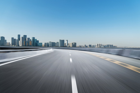 Empty road floor surface with modern city landmark buildings of hangzhou bund Skyline,zhejiang,chinaの写真素材