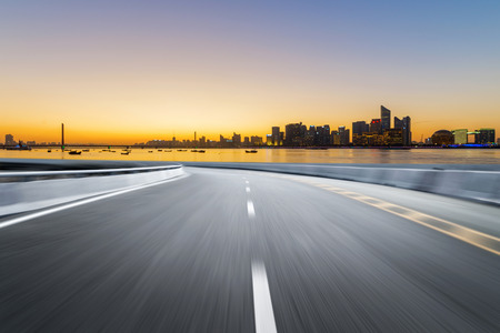 Empty road floor surface with modern city landmark buildings of hangzhou bund Skyline,zhejiang,chinaの写真素材