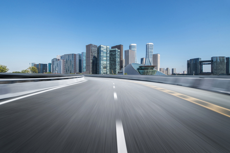 Empty road floor surface with modern city landmark buildings of hangzhou bund Skyline,zhejiang,chinaの写真素材