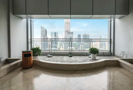 Empty office space and Windows outside skyscrapers in shenzhen, Chinaのeditorial素材