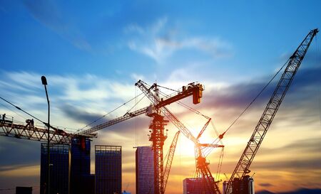 Tower cranes, skyscrapers on construction sitesの写真素材