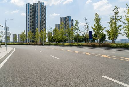 asphalt road and green tree in countrysideの写真素材
