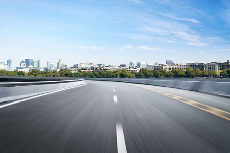 Empty road floor surface with modern city landmark buildings of hangzhou bund Skyline,zhejiang,chinaの写真素材
