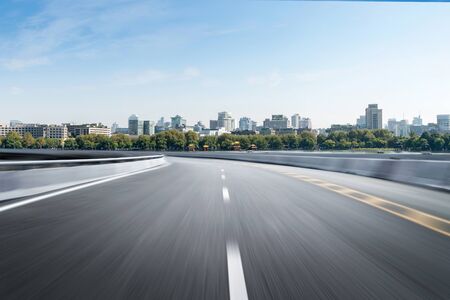 Empty road floor surface with modern city landmark buildings of hangzhou bund Skyline,zhejiang,chinaの写真素材