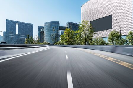 Empty road floor surface with modern city landmark buildings of hangzhou bund Skyline,zhejiang,chinaの写真素材