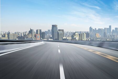 Empty road floor surface with modern city landmark buildings of hangzhou bund Skyline,zhejiang,chinaの写真素材