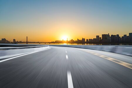 Empty road floor surface with modern city landmark buildings of hangzhou bund Skyline,zhejiang,chinaの写真素材