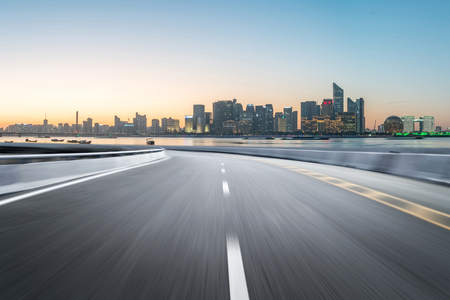 Empty road floor surface with modern city landmark buildings of hangzhou bund Skyline,zhejiang,chinaのeditorial素材