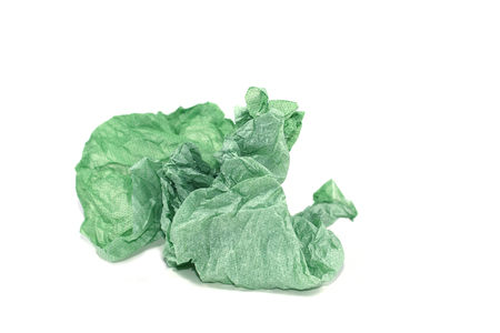 the disheveled green paper on white background and lithe shadowの写真素材