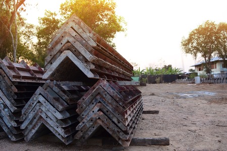 the stack of iron templates and some tool  in construction siteの写真素材