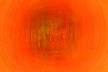 the bright orange with radial blurred  backgroundの写真素材