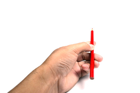 a hand holding  color pencil on white background isolated