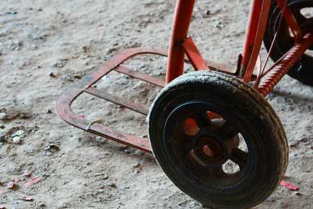 the old red cart with rough groundの写真素材
