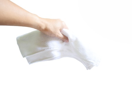 Adult hand holding a white towel after exercise on white background isolatedの写真素材