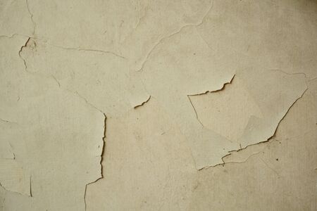 the cracked of paint on old wall l in countryside of Thailand