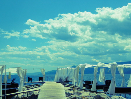 Bridge and sunshades on the beach cloudy in Rijeka Rijeka, Croatiaのeditorial素材