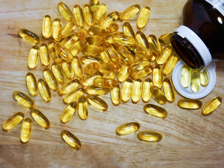 Fish oil on woodの写真素材