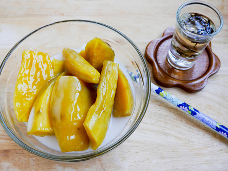 Sweet potato thai dessert with chinese tea on woodの写真素材