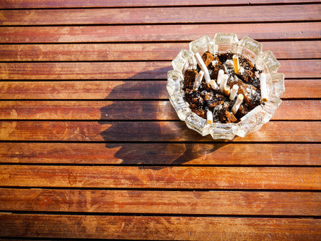 ashtray in strong sunlight soft focusの写真素材