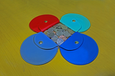 assorted coin purse with mixed coins の写真素材