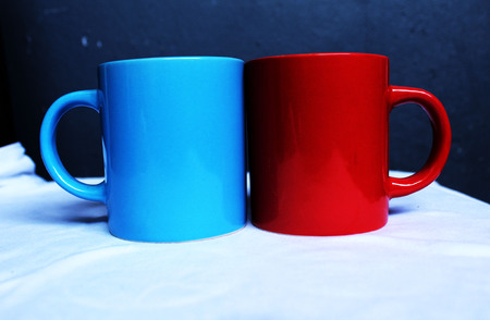 blue and red ceramics mugs for loving coupleの写真素材