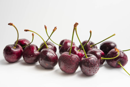 fresh cherry with white background. water droplets.の写真素材