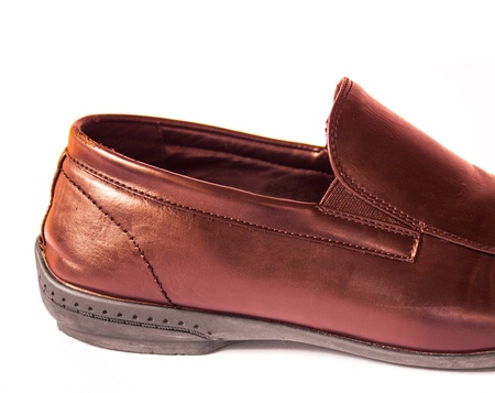 Brown metalic shoes on a white background の写真素材