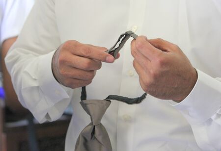 Groom wedding preparation  A groom gets ready for his weddingの写真素材