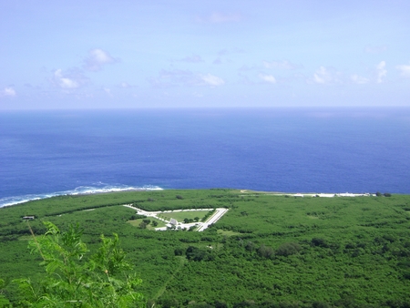 CNMI Veterans Cemetery, aerial view The CNMI Veterans Cemetery represented by the white triangular area in Marpi, Saipan.の写真素材
