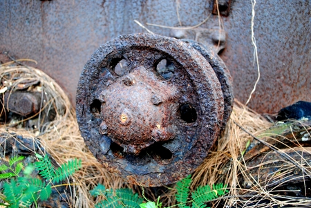 Rusty rim of a wheel from a world war 2 Japanese tanker at the Aslito Airfield, Saipan