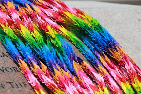 Colorful origami paper cranes offered by Japanese citizens to honor their dead ancestorsの写真素材