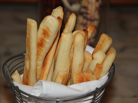 A rack of delicious freshly baked stick bread ready to eat