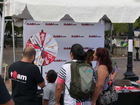 Washington, D.C. USA- September 2017: A group of people takes their chances at a spinning wheel at...