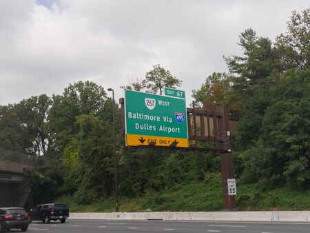 Washington, D.C. USA- September 2017: Directional roadside sign to Batimore via Dulles Airport at Highway 495 in Washington, District of Columbia.のeditorial素材