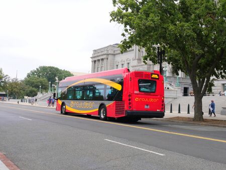 Washington, D.C. USA- September 2017: A DC Circulator bus parks on the street curb to pick up and let off passengers in Washington, District of Columbia.のeditorial素材