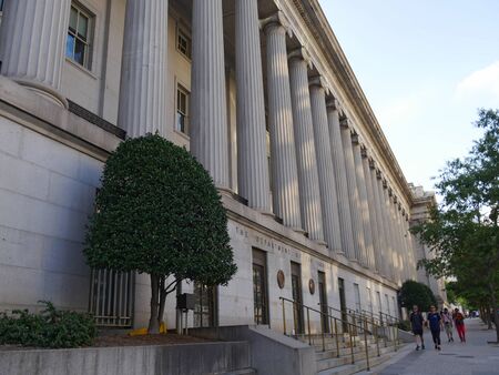 Washington, D.C. USA- September 2017: People walking on the streetside by the Department of Treasury building in Washington, District of Columbia.のeditorial素材