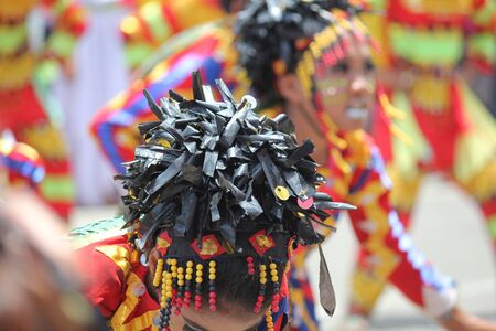 Davao City, Philippines-August 2014: Close up of a headress worn by a performer at the Kadayawan streetdancing competition. Kadayawan is celebrated August each year to give thanks for life and an abundant harvest.のeditorial素材